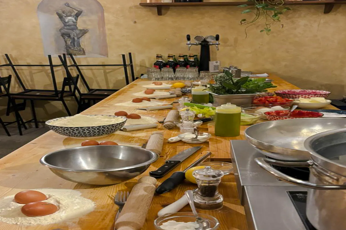 Cooking class setup with ingredients and utensils for pasta and dessert making in Florence.