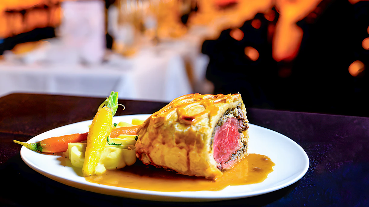 Beef Wellington served with vegetables at Paradis Latin.