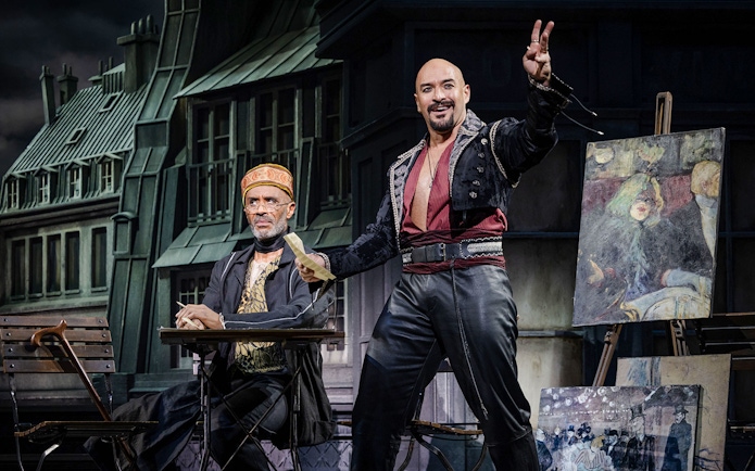 Stage scene from Moulin Rouge! The Musical West End with actors in period costumes.