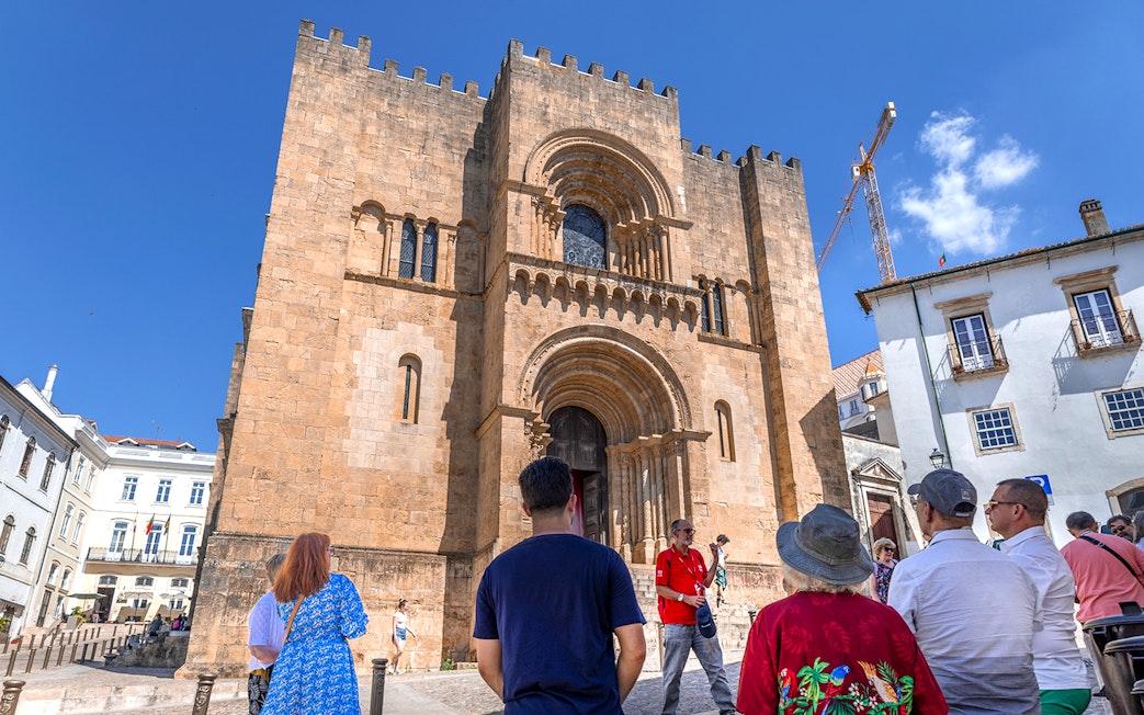 Tour group at the Old Cathedral of Coimbra during Fátima & Coimbra full-day tour from Porto.