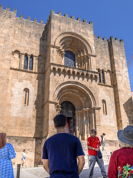 Tour group at the Old Cathedral of Coimbra during Fátima & Coimbra full-day tour from Porto.