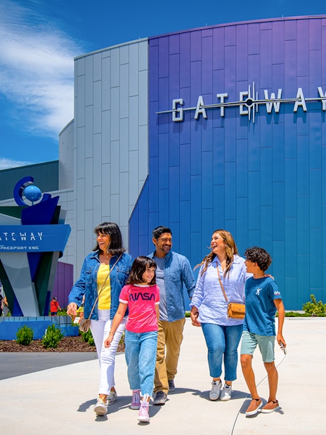 Visitors walking outside the Gateway building at Kennedy Space Center.