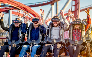 Visitors enjoying a VR roller coaster at Tivoli Gardens, Copenhagen.