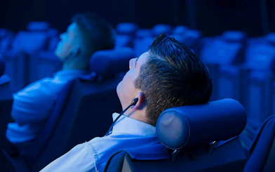 Guests reclining in seats at the Planetarium Museum of Transport, Lucerne.