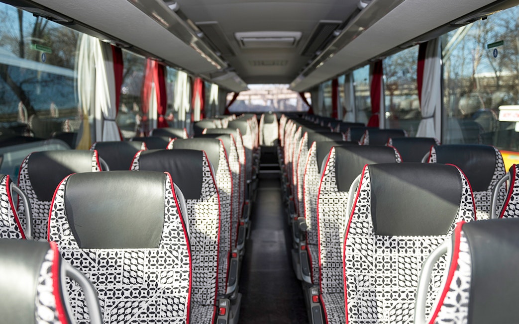 Interior of SIT shuttle bus from Ciampino Airport to Roma Termini, showing patterned seats.