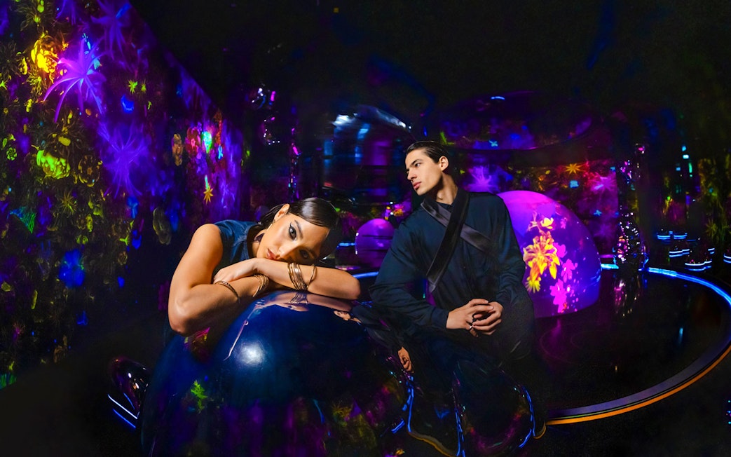 Immersive experience at AYA Universe with vibrant neon lights and interactive displays.