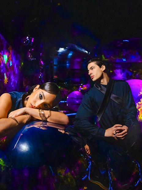 Immersive experience at AYA Universe with vibrant neon lights and interactive displays.