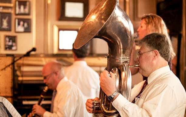 Musicians playing jazz instruments on the Riverboat City of New Orleans brunch cruise.