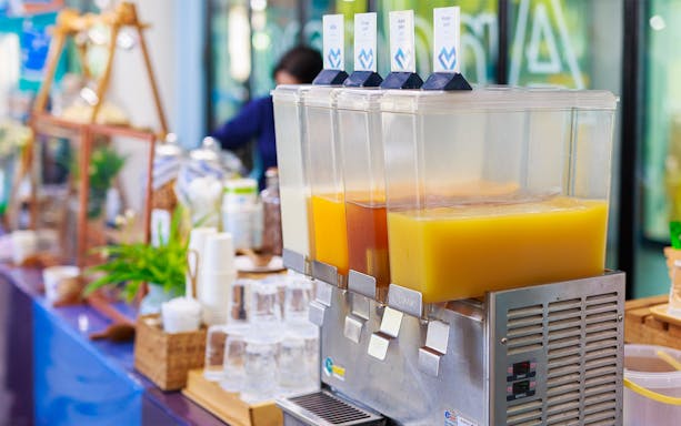 Juice dispensers at breakfast station on Phi Phi Islands tour.