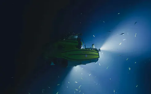 OceanXplorer submarine exploring deep waters near ArtScience Museum, Singapore.