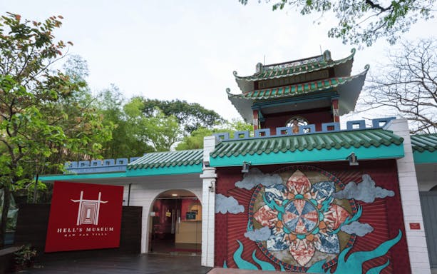 Main entrance to Hell's Museum at Haw Par Villa, Singapore, featuring a distinct mural.