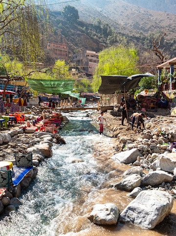 Colourful waterside restaurants along a stream in the Ourika Valley, Morocco.