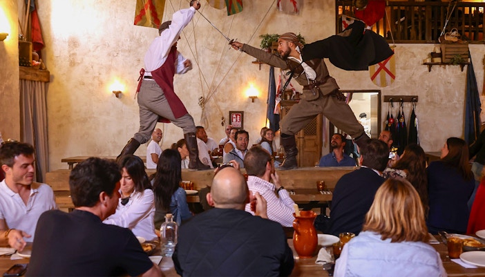 Puy du Fou El Bodegon del Capitan dining experience with historical decor.