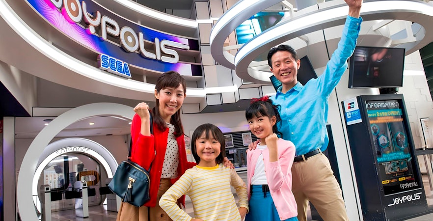 Asian family having a fun time in Joypolis, Tokyo