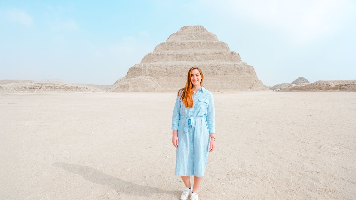 Person standing in front of the Pyramid of Djoser in Giza, Egypt.