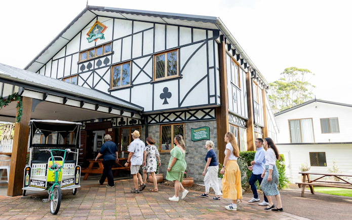 Visitors entering Tamborine Mountain Distillery, Queensland, for a tasting tour.