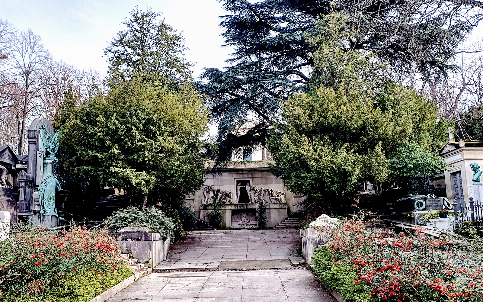 Pathway leading to ornate tombs at Père Lachaise Cemetery, Paris.