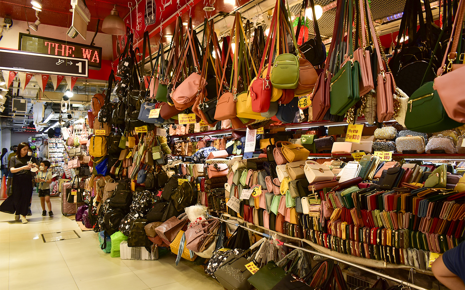 Bugis Street Market in Singapore bustling with shoppers and vibrant street stalls.