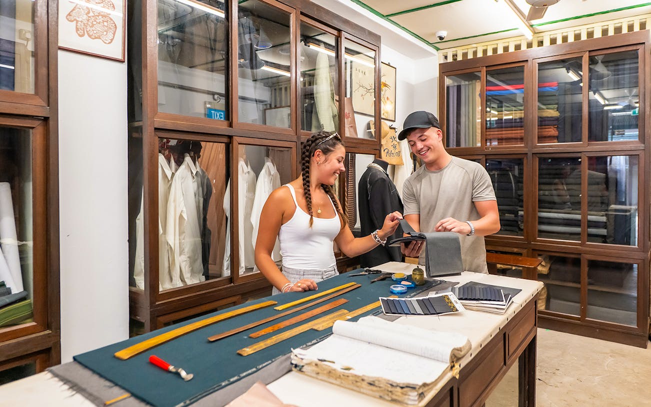 Visitors exploring Shophouse Living exhibit at Chinatown Heritage Centre.