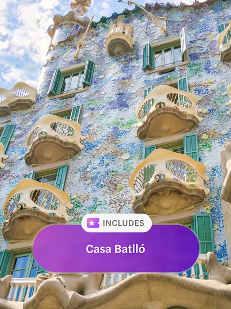 Casa Batlló facade with colorful mosaic tiles and unique balconies in Barcelona.