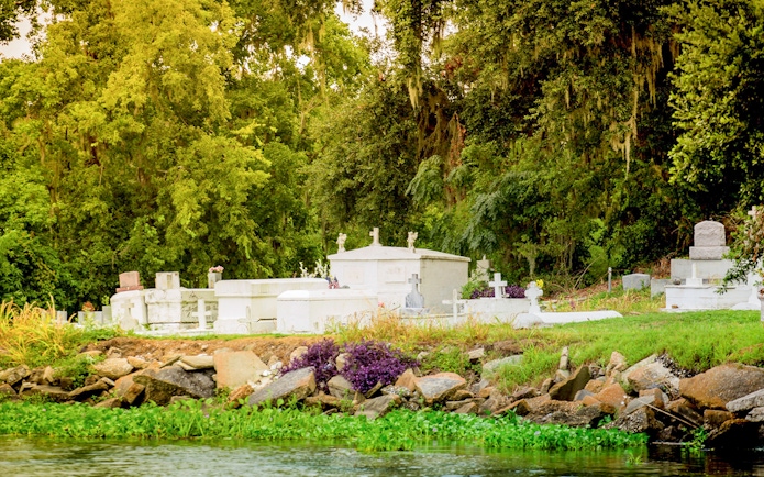 Cemetery along the water during Swamp Tour & Oak Alley Plantation Tour.