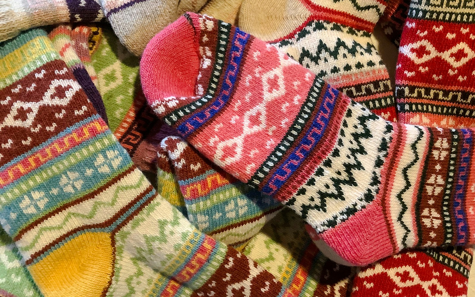 Colorful woolen socks with traditional patterns from Levi, Finland.