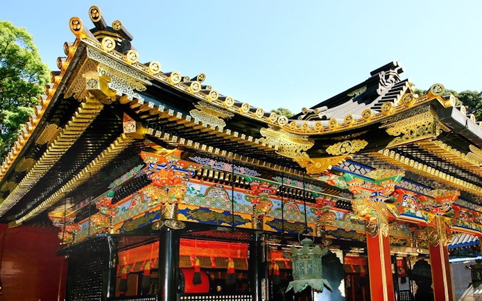 Nikko Toshogu Shrine ornate roof with gold and colorful carvings in Japan.