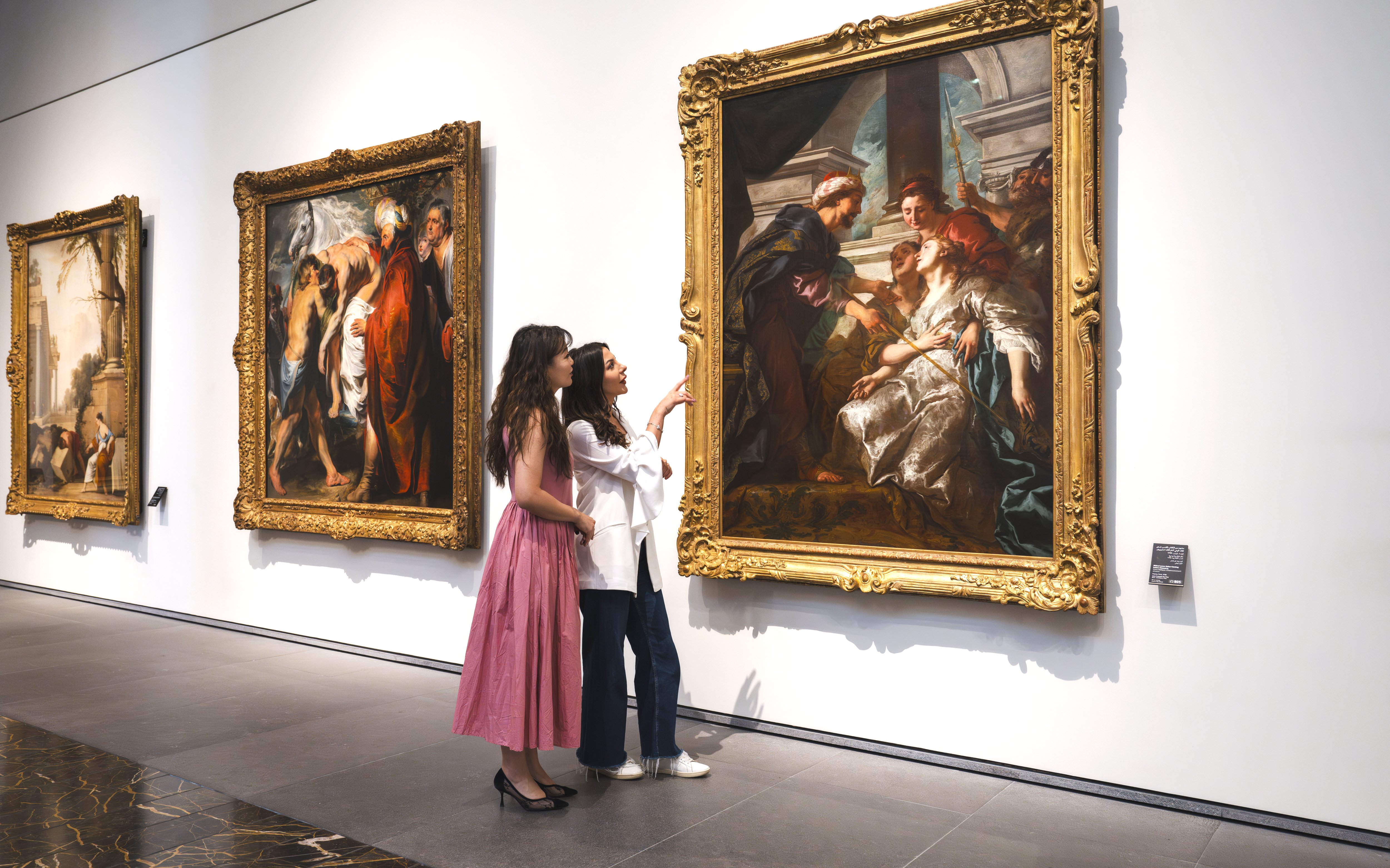 Women viewing "The Education of the Virgin" by Rubens at Louvre Abu Dhabi.