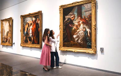Women viewing "The Education of the Virgin" by Rubens at Louvre Abu Dhabi.
