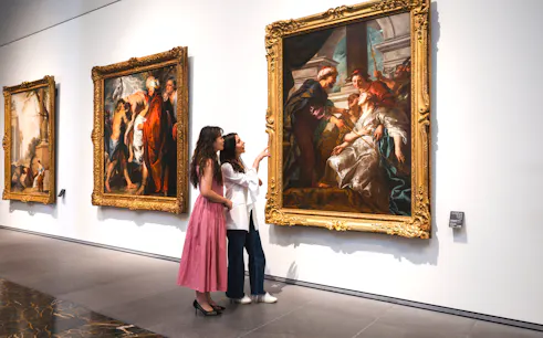 Women viewing "The Education of the Virgin" by Rubens at Louvre Abu Dhabi.