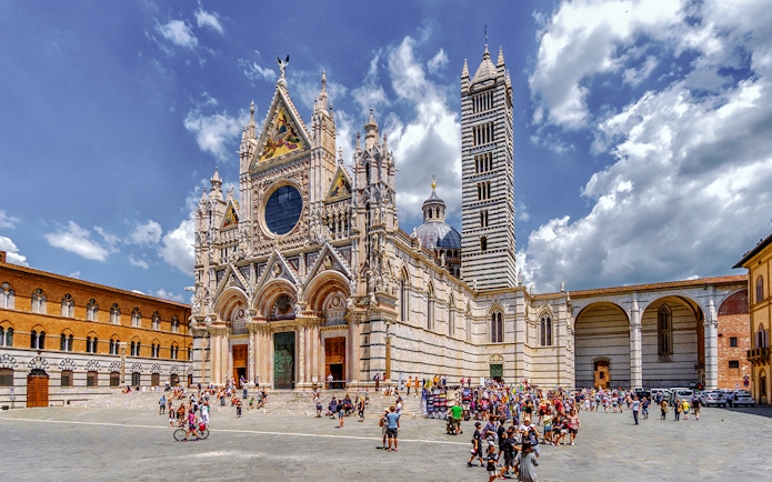 Siena Cathedral with tourists in the square, part of San Gimignano, Siena, Monteriggioni, Chianti day trip.