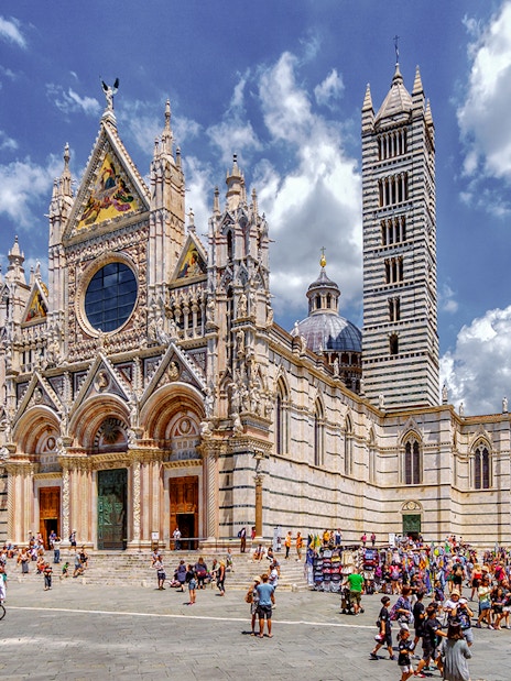 Siena Cathedral with tourists in the square, part of San Gimignano, Siena, Monteriggioni, Chianti day trip.