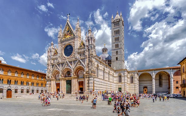 Siena Cathedral with tourists in the square, part of San Gimignano, Siena, Monteriggioni, Chianti day trip.