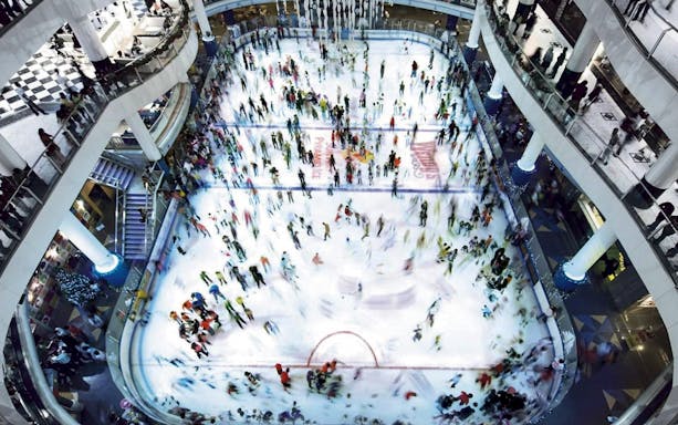 Crowded ice skating rink at Sunway Pyramid in Kuala Lumpur.