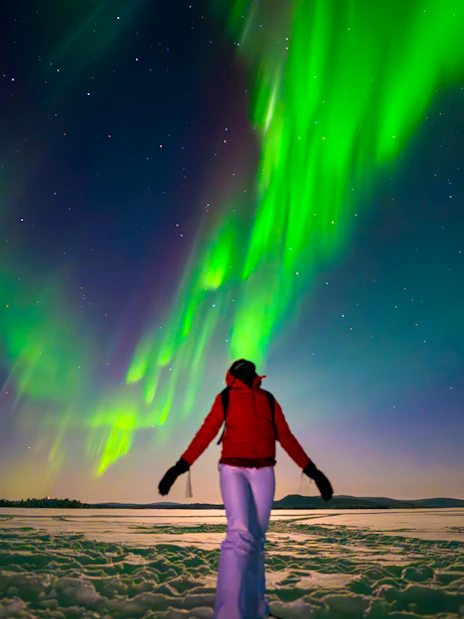 Person viewing Northern Lights during AURORA PRO photography expedition.