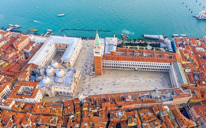 Aerial view of San Marco Square and Basilica of Saint Mark during a helicopter tour in Venice.