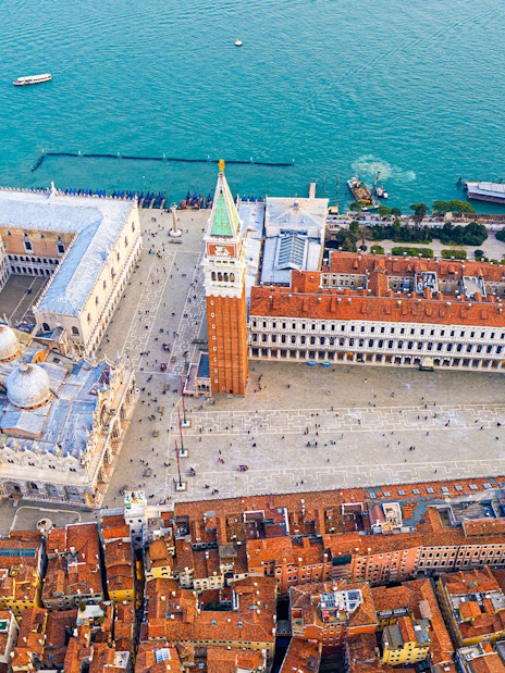 Aerial view of San Marco Square and Basilica of Saint Mark during a helicopter tour in Venice.