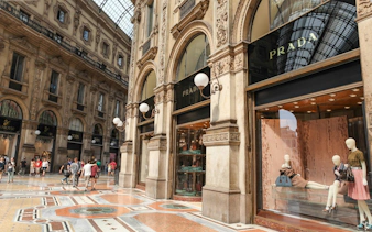 Galleria Vittorio Emanuele II in Milan with Prada storefront and shoppers.