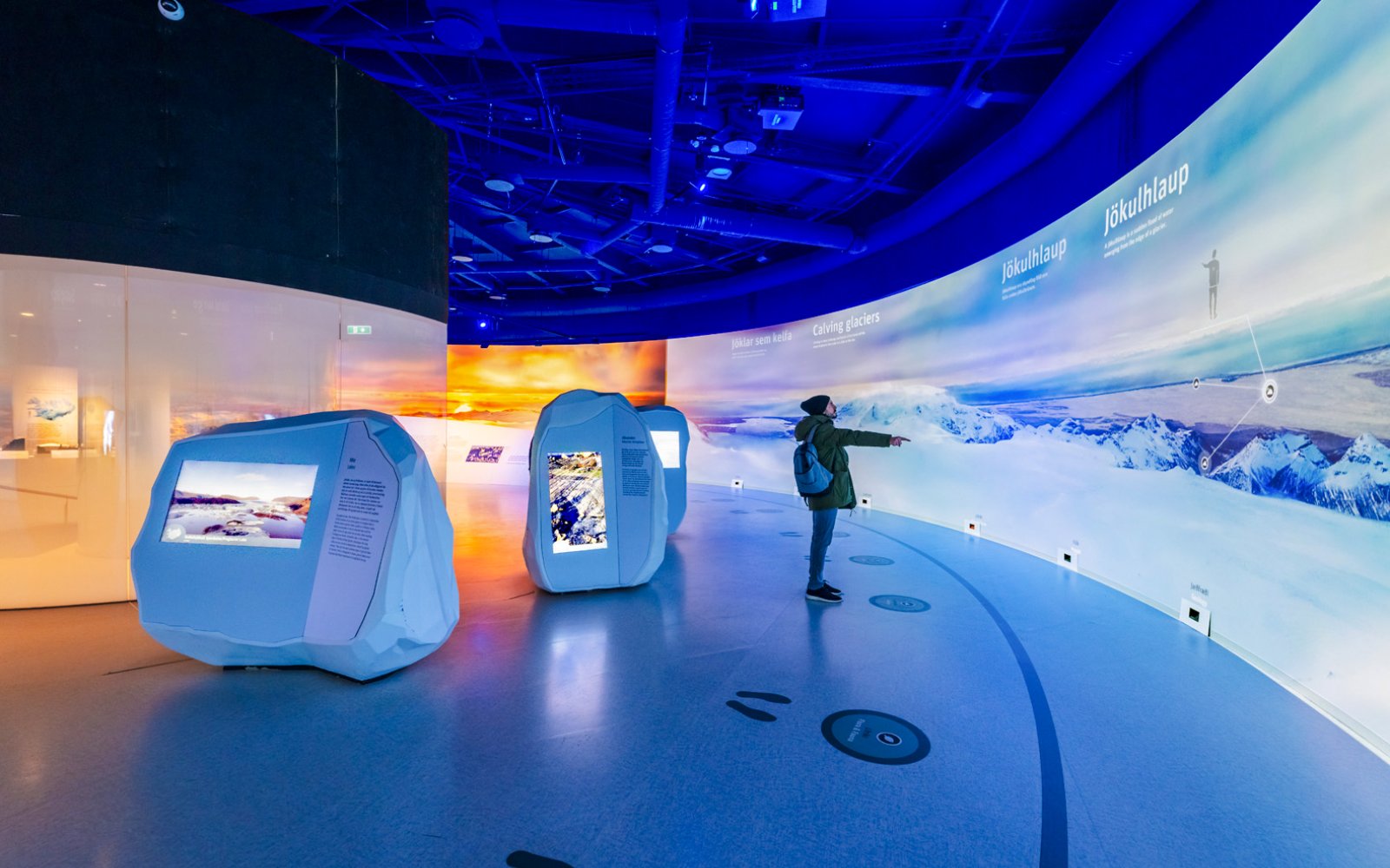 Guests exploring interactive glacier exhibits at Perlan Museum in Reykjavik.