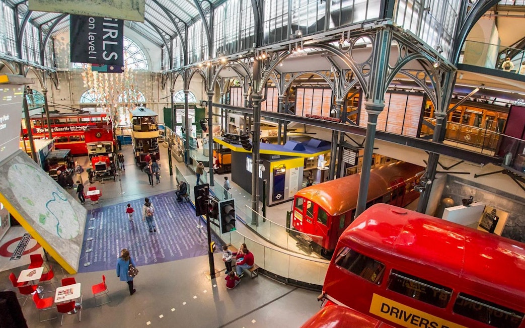 London Transport Museum exhibit with vintage underground train and double-decker buses.