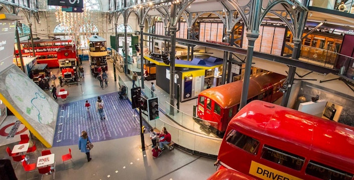 London Transport Museum exhibit with vintage underground train and double-decker buses.