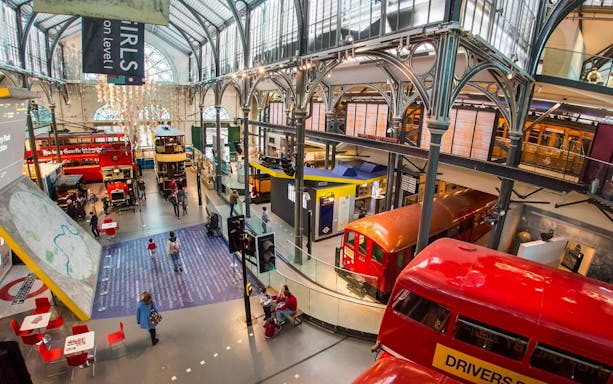 London Transport Museum exhibit with vintage underground train and double-decker buses.