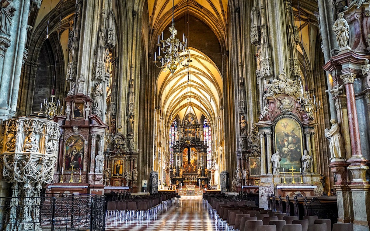 St. Stephen’s Cathedral interior with ornate columns and altar in Vienna.