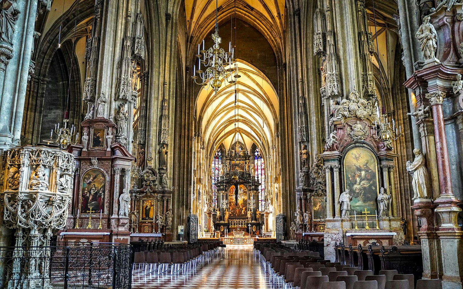 St. Stephen’s Cathedral interior with ornate columns and altar in Vienna.