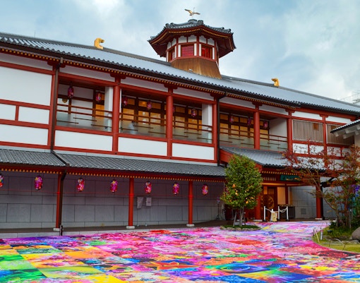 Oedo-Onsen-Monogatari traditional Japanese bathhouse with people enjoying hot spring baths.