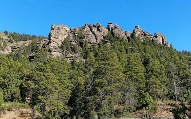 Rocky formations above forested landscape in Patagonia's Enchanted Valley.