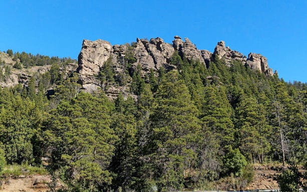 Rocky formations above forested landscape in Patagonia's Enchanted Valley.