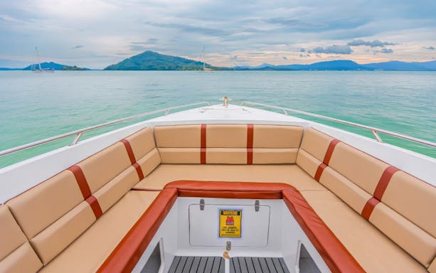 Speedboat deck with seating, approaching islands in Phuket.