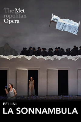 La Sonnambula performance at the Metropolitan Opera with a suspended bed and performers on stage.