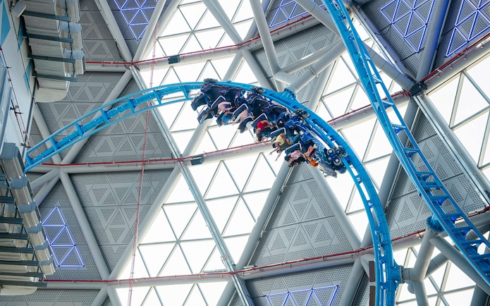 Riders on The Storm Coaster loop inside Dubai's indoor theme park.